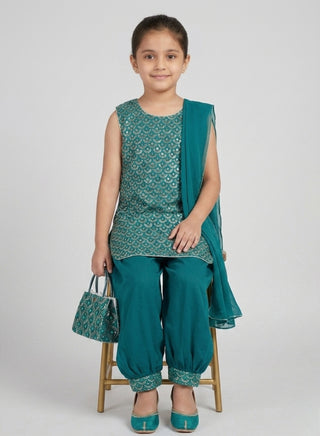 Girl wearing a teal green embroidered sleeveless kurta with matching Patiala salwar and chiffon dupatta ethnic wear set for kids aged 4–12 years.
