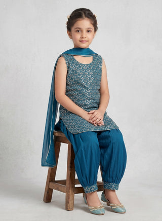 Girl wearing a embroidered sleeveless kurta with matching Patiala salwar and chiffon dupatta ethnic wear set for kids aged 4–12 years.