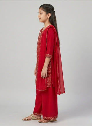 Girl wearing a embroidered sleeveless kurta with matching Patiala salwar and chiffon dupatta ethnic wear set for kids aged 4–12 years.