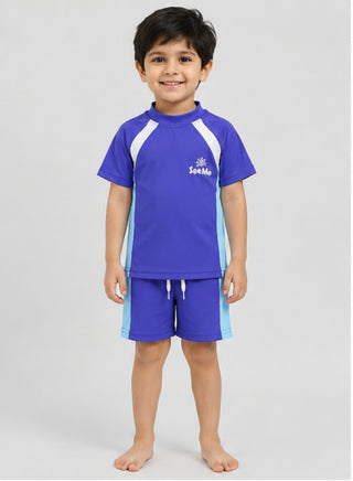 Smiling boy wearing royal blue short-sleeve swim top and shorts with white and light blue panels