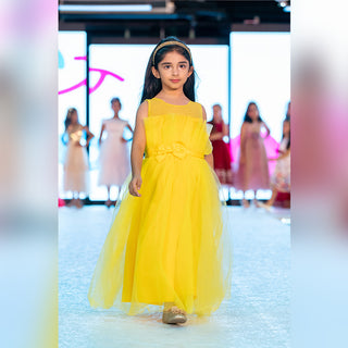 Yellow mesh party dress with front bow and ruffled hem