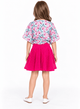 Elegant floral print top with pleated pink skirt