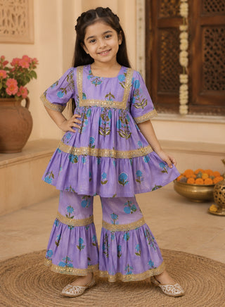 Girls lavender floral printed peplum kurta and sharara ethnic wear set with gold lace detailing for ages 1–10 years.