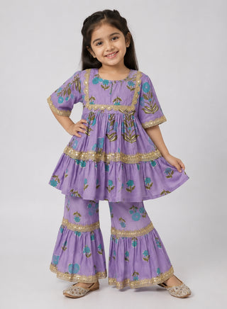 Girls lavender floral printed peplum kurta and sharara ethnic wear set with gold lace detailing for ages 1–10 years.