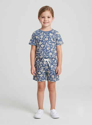Girl wearing beige floral print cotton t-shirt and matching drawstring shorts set, front view — summer casual outfit for ages 1 to 12 years