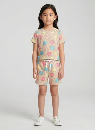Girl wearing beige floral print cotton t-shirt and matching drawstring shorts set, front view — summer casual outfit for ages 1 to 12 years