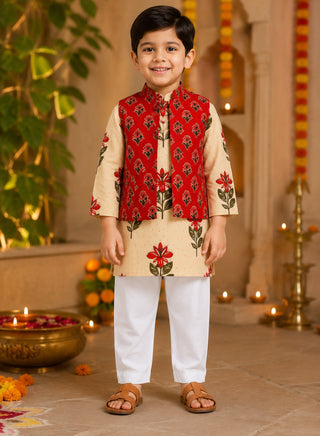 Boy wearing a cream floral printed kurta with a red floral Nehru jacket and white pajama ethnic wear set for kids aged 1–10 years.