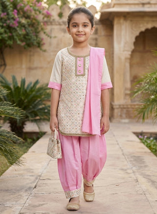 Girl wearing a pink embroidered sleeveless kurta with matching Patiala salwar and chiffon dupatta ethnic wear set for kids aged 4–12 years.
