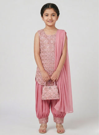 Girl wearing a rose pink embroidered sleeveless kurta with matching Patiala salwar, chiffon dupatta, and coordinating handbag ethnic wear set for kids aged 4–12 years.