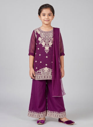 Girl wearing a purple embroidered kurta with matching palazzo pants and chiffon dupatta ethnic wear set for kids aged 4–12 years.