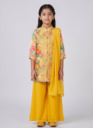 Girl wearing a yellow floral embroidered kurta with matching palazzo pants and chiffon dupatta ethnic wear set for kids aged 4–12 years.